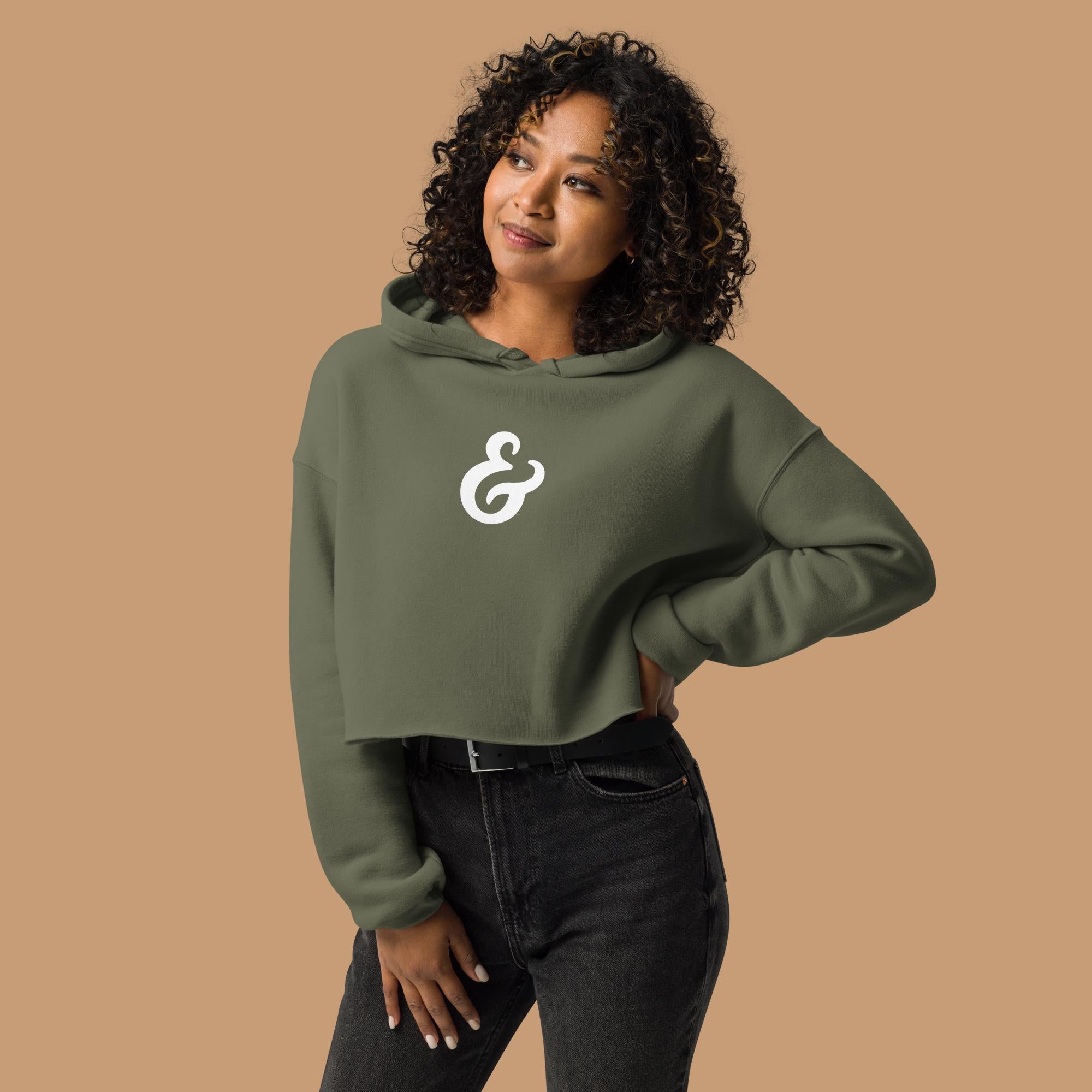 Olive Green cropped hoodie with a white ampersand on the front on a model