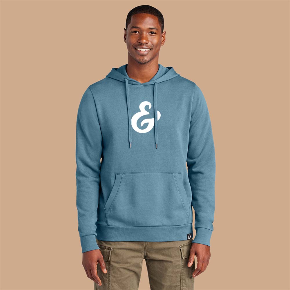 Dusk Blue fleece hoodie with a white ampersand on the front on a model