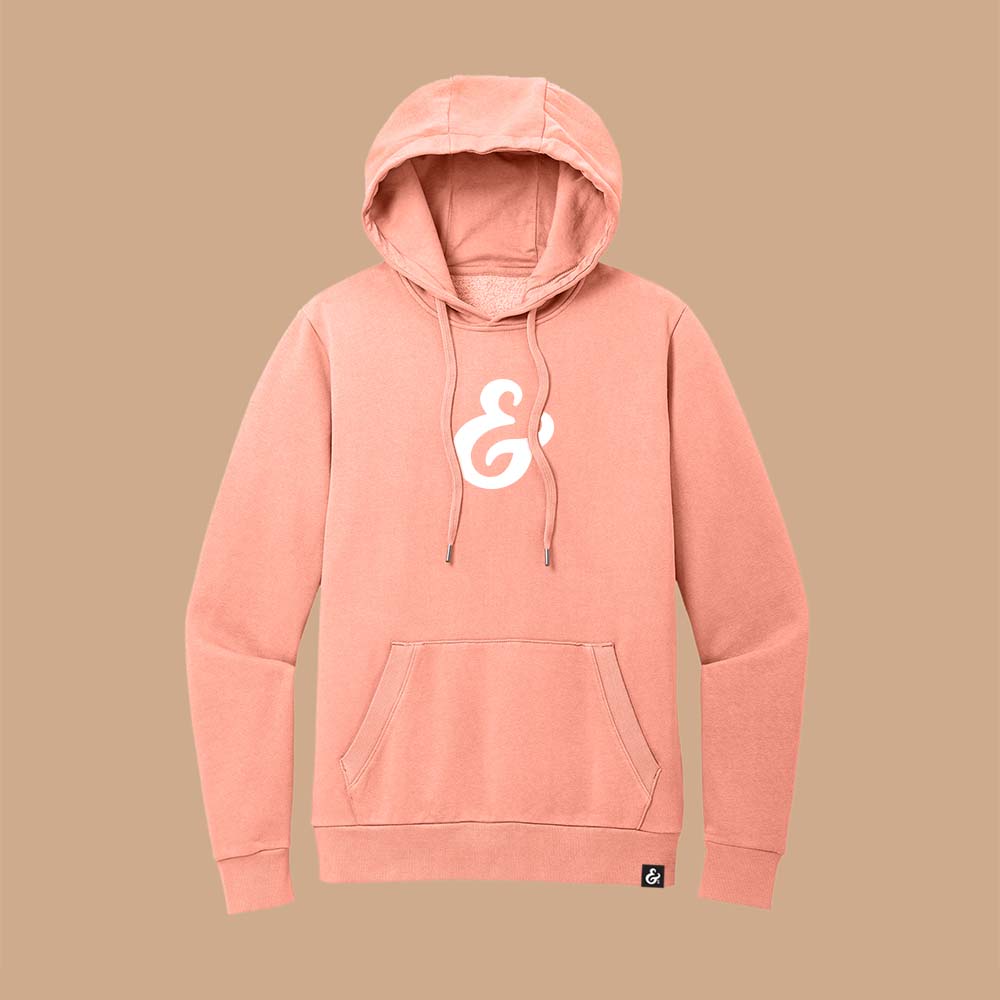 Peach fleece hoodie with a white ampersand on the front